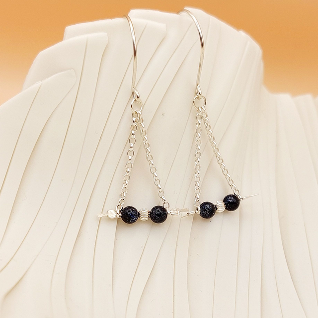 Sterling silver drop earrings with blue goldstone gemstone beads