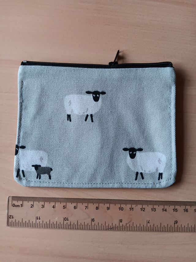 Sheep on a grey Background Zipped Purse with Red Waterproof Lining, and Black Zip.