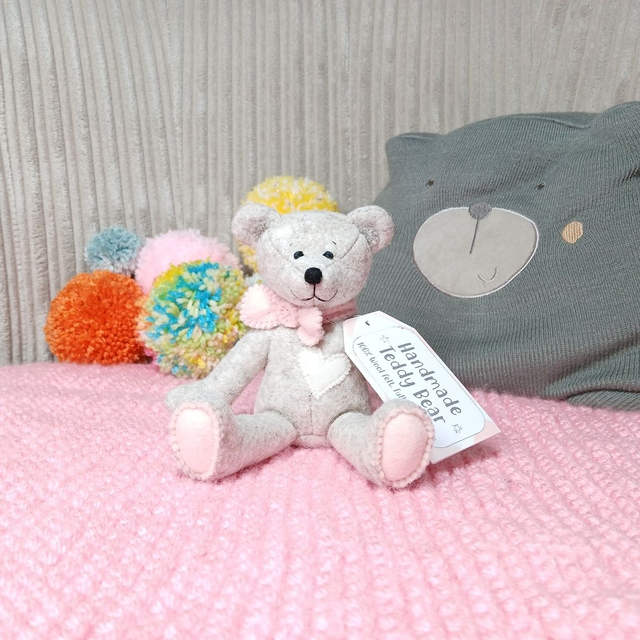 No name* traditional beige bear. Soft pink bow tie. Small size, handmade teddy bear. UKCA. Tray base. Standard Wool Felt. Beige. Cream. Blush. Pastel.