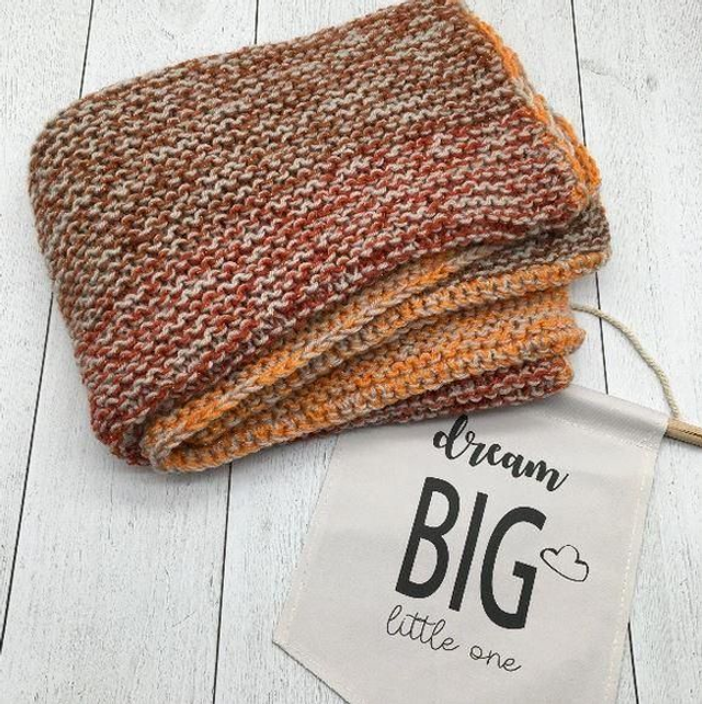 Couverture tricot orangée