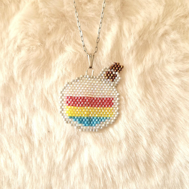 Pendentif Fiole avec drapeau Pan