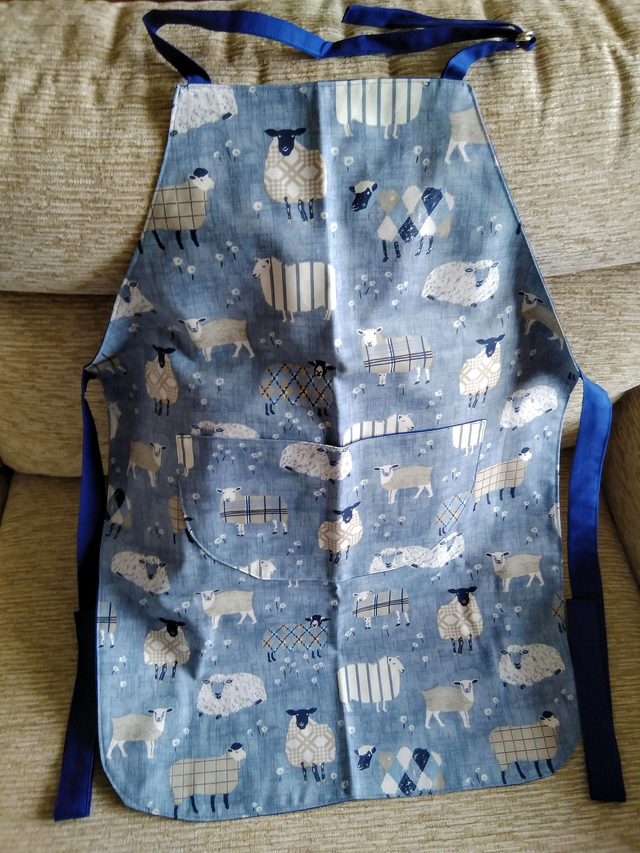 Adult Kitchen Apron Baa Baa Denim Sheep Patterned Cotton Fabric with Front pocket and Blue lining, waist ties and adjustible neck ties