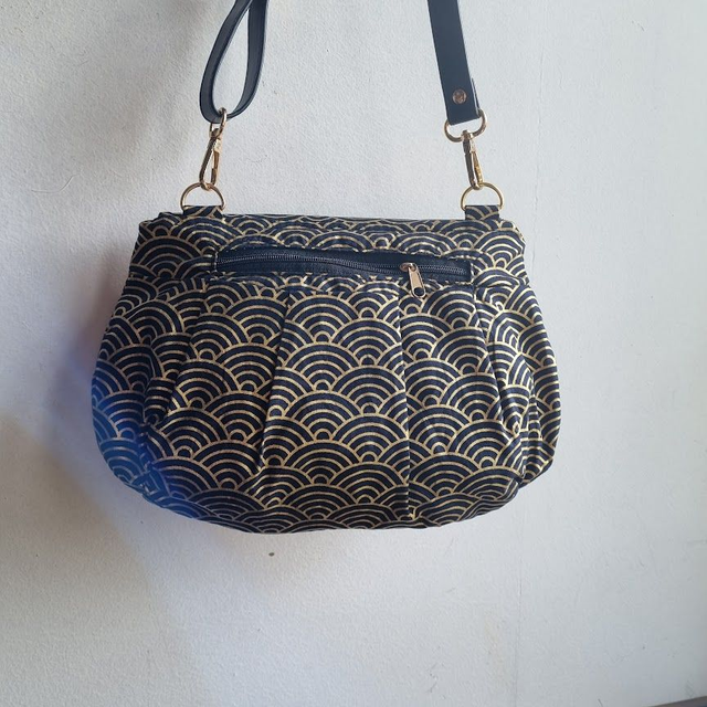 Sac forme pochette "Nami" noir doré