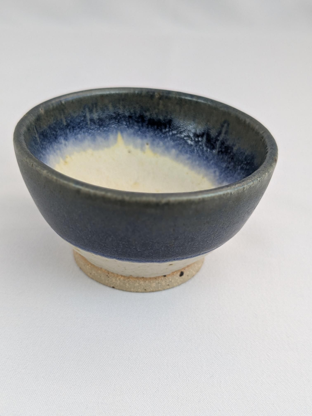 Small light oatmeal and blue bowl 