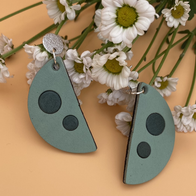 Teal spotted semi circle leather earrings 