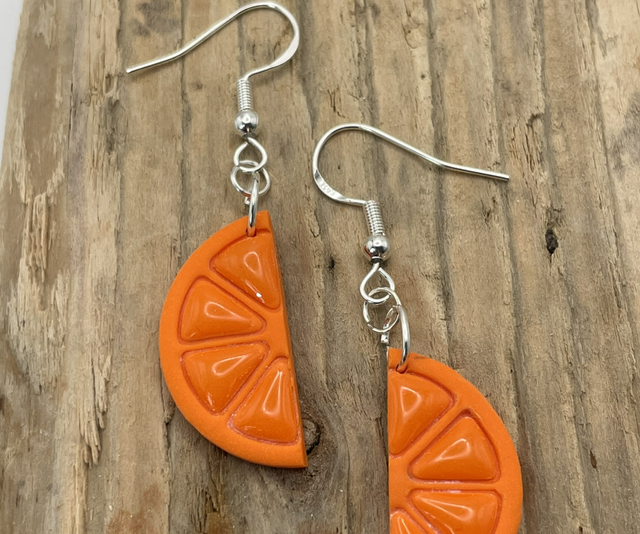 Half orange slices on hooks