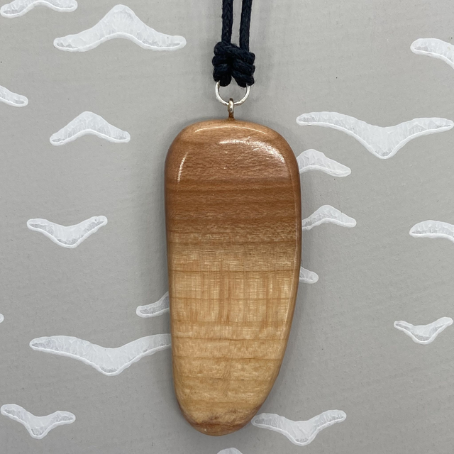 Plum pendant with a smooth front and rough back - I was pruned [023-0091]