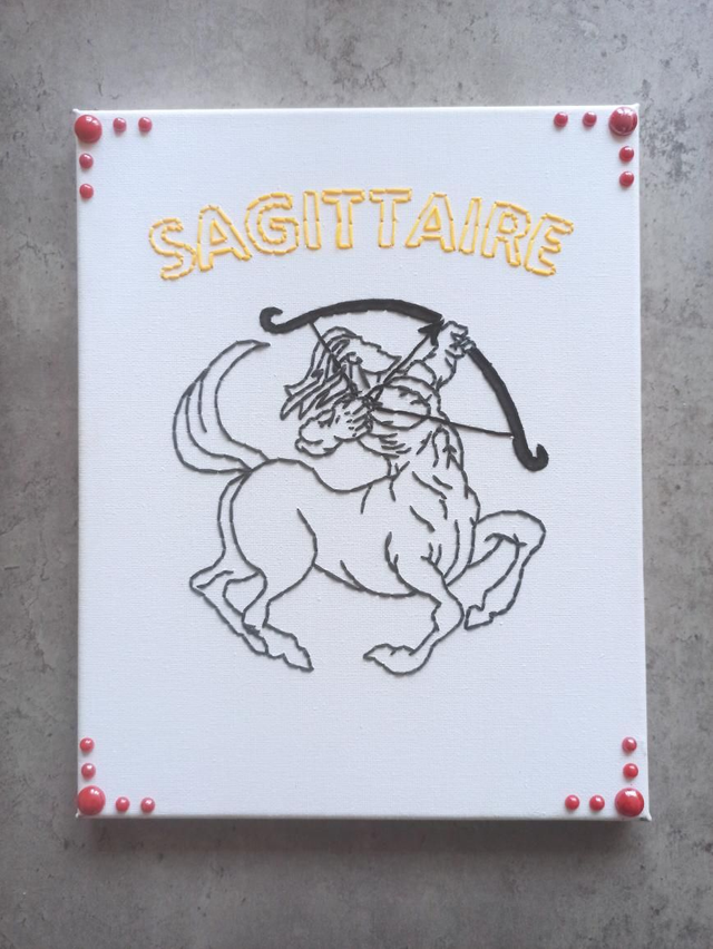 Toile brodée signe astro Sagittaire 