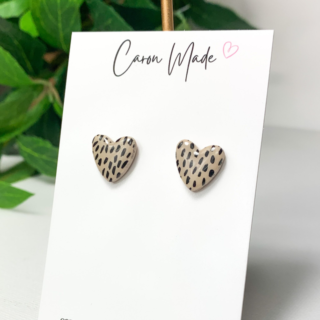 Beige and black speckled heart stud earrings