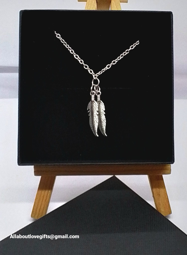 Bracelet Beautifully Hand Made Chain with Two Feather Pendants.