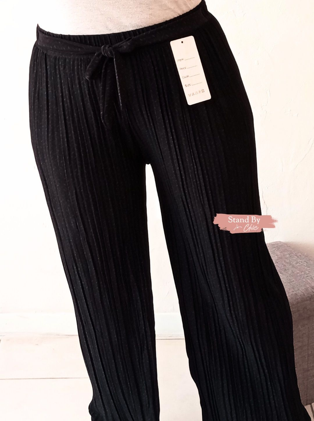 Pantalon palazzo noir plissé à motif
