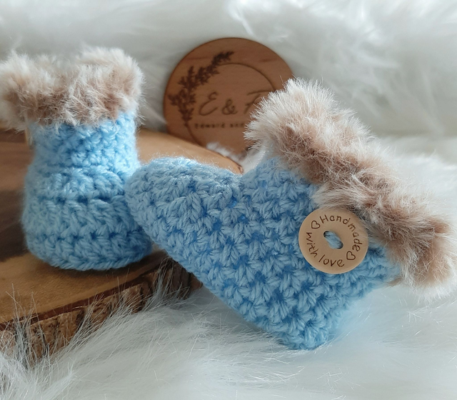 Crochet handmade baby booties with faux fur trim for ages 0-3 months