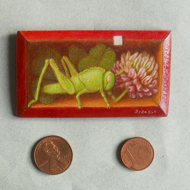 Trompe l&#039;oeil painting with a green grasshopper and a clover flower 
