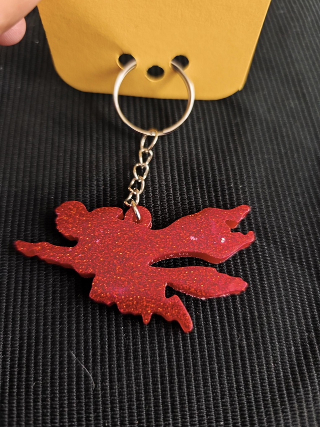 Porte-clé homme volant rouge pailleté 