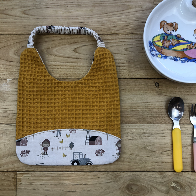 Bavoir jaune fermier, à élastique 