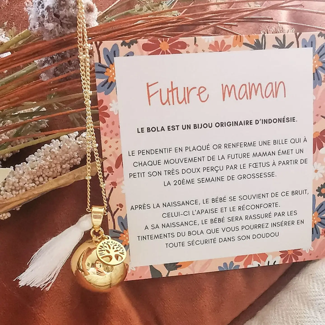 Bola de grossesse doré avec pompon blanc