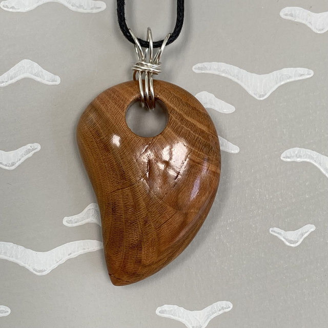 Cherry, shark tooth shaped pendant with sterling silver twisted wire bail - I was pruned from the garden [048-0109]