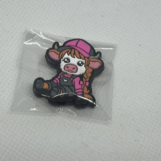 Ku med flette Maskestopper