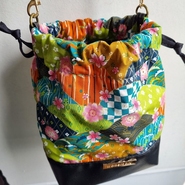 Baluchon "Fanny" vert & simili cuir noir