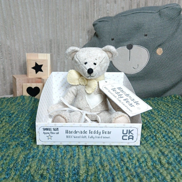Traditional beige bear. *No name*. Small size, handmade teddy bear. UKCA. Tray base. Standard Wool Felt. Pastel yellow. Cream. Beige.