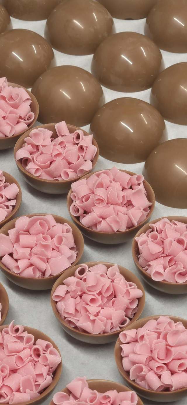 Hot chocolate ball with strawberry.