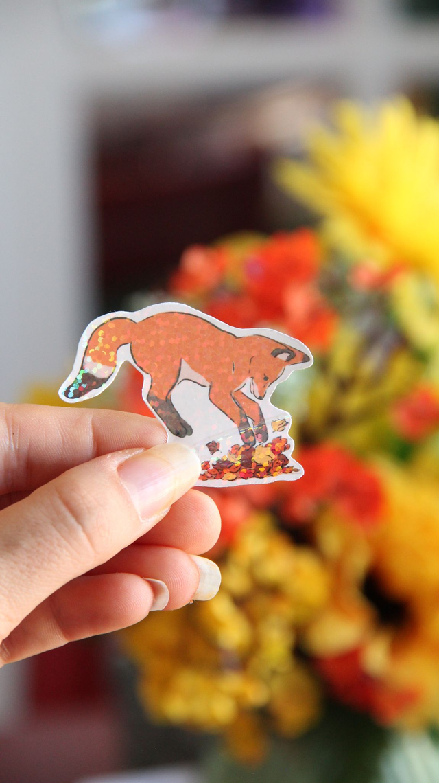 Sticker renard  dans les feuilles 