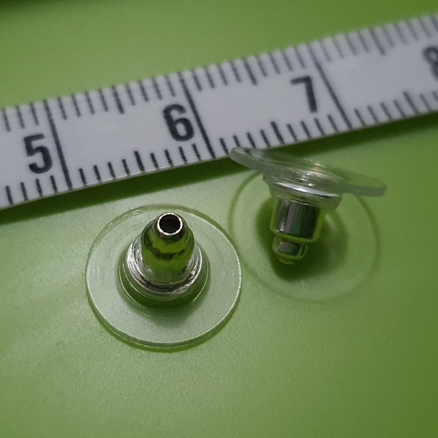 Silver and silicone back fitting. 
Alternative to butterfly fixings for stud earrings (pair).