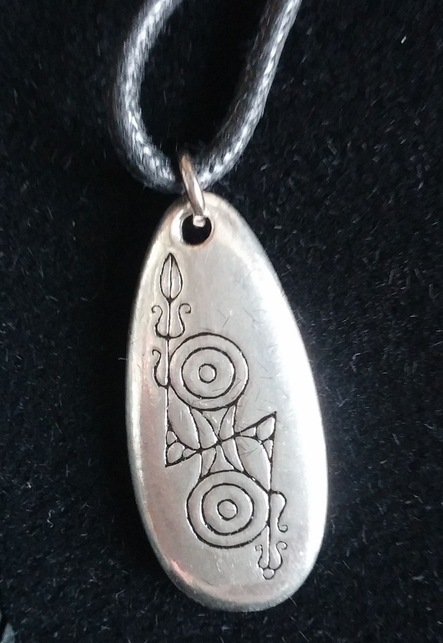 Pewter pendant (inscribed double disc and Z-rod)