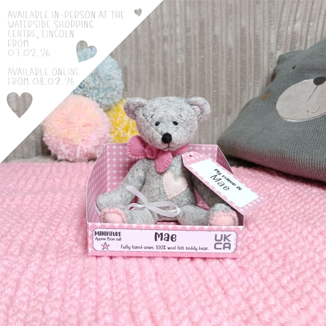 Mae. Miniature size, handmade teddy bear. UKCA. Tray base packaging. Standard Wool Felt. Grey. Pink.