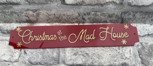 Christmas at the mad house sign