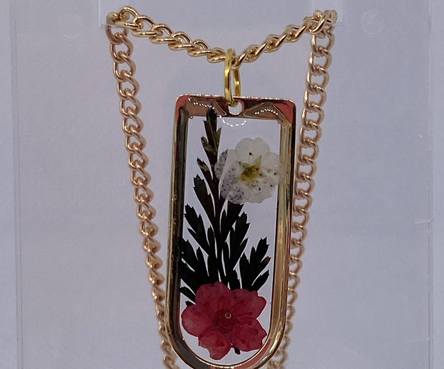 Gold necklace with real flowers