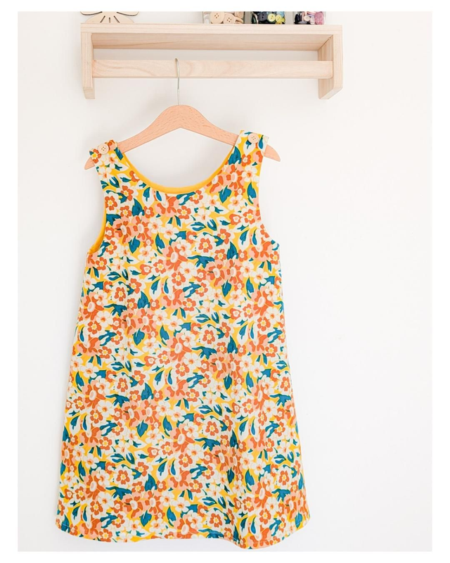 Robe tablier enfant Marguerite – robe sans manches fille en popeline coton fleurie