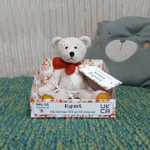Rupert. Small size, handmade teddy bear. UKCA. Tray base packaging. Standard Wool Felt. Beige. Red. Mustard. White. 