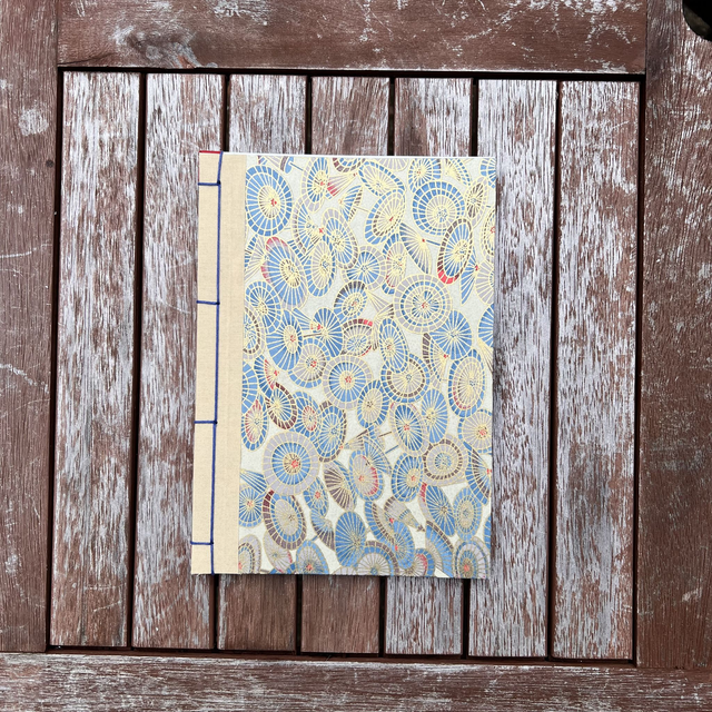 A5 Notebook — Gold umbrellas — Plain 90gsm paper