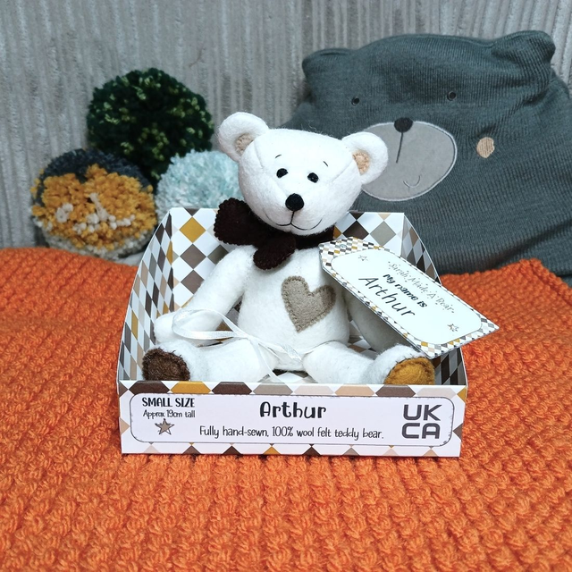Arthur. Small size, handmade teddy bear. UKCA. Tray base packaging. Standard Wool Felt. White. Brown. Beige. Mustard. Caramel.