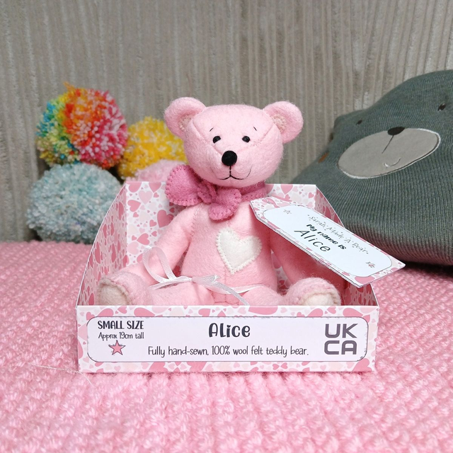 Alice. Small size, handmade teddy bear. UKCA. Tray base packaging. Standard Wool Felt. Baby pink. Cherry Blossom pink. Blush. White.