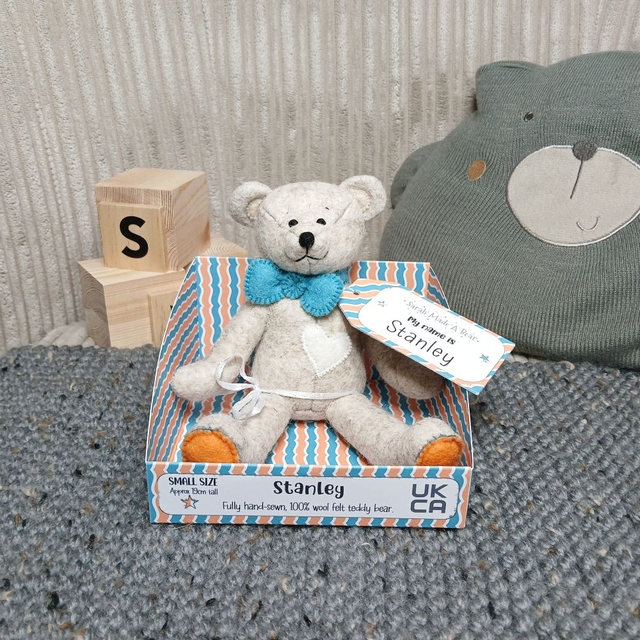 Stanley. Small size, handmade teddy bear. UKCA. Tray base packaging. Standard Wool Felt. Beige. Orange. Blue. White. 