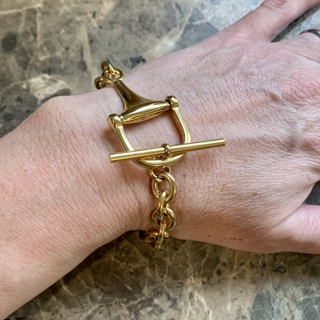 Gold colour snaffle bit fastening bracelet 