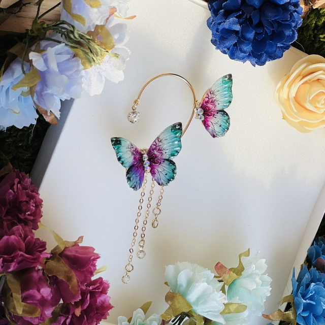 Papillon turquoise violet