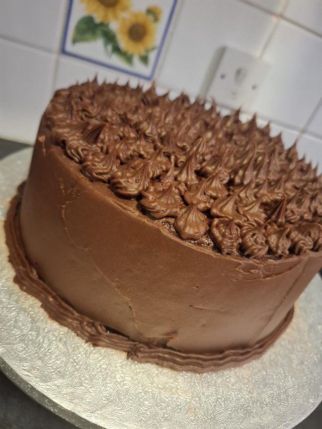 Red Velvet Cake covered with Indulgent Chocolate Fudge Icing.