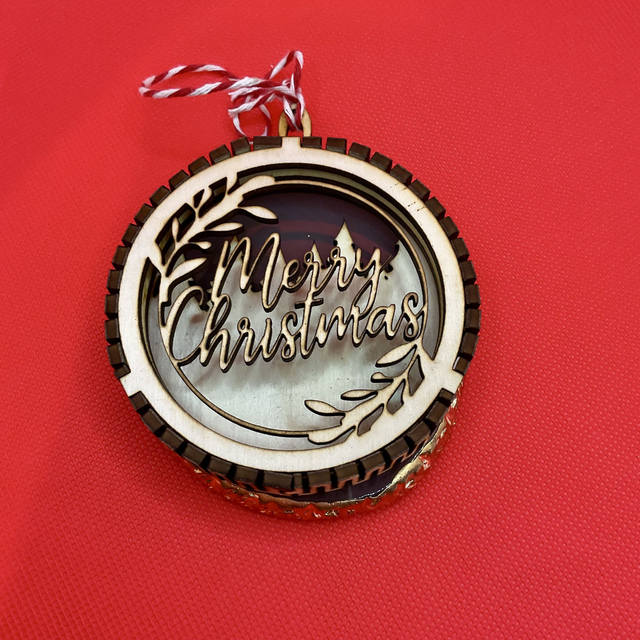 Laser cut Christmas ornament. Wooden design.