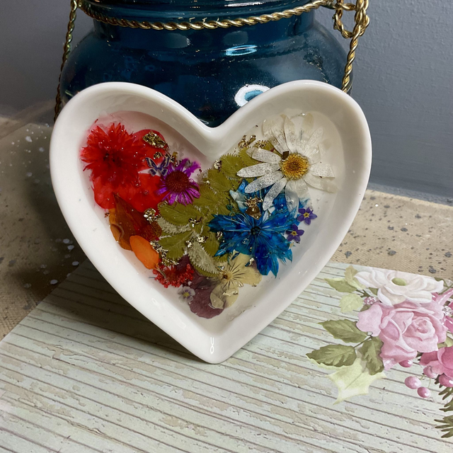White porcelain ring trinket with pressed flowers in resin.