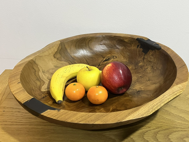 Fruit bowl made from teak tree root.