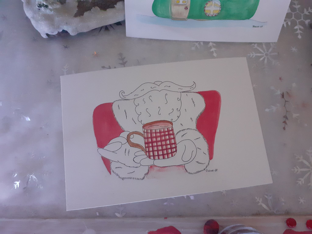 Le Père Noël prend son chocolat chaud