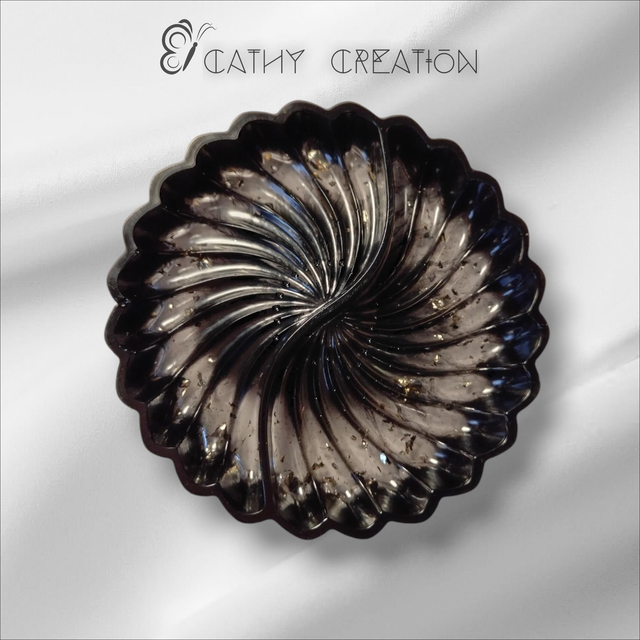 Vide poche noir et doré 