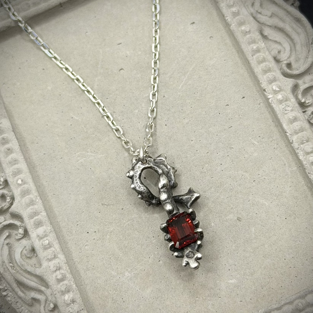 Garnet Skeletal Form pendant necklace