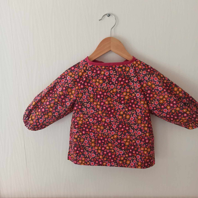 Bavoir/Tablier manches fleuris moutarde