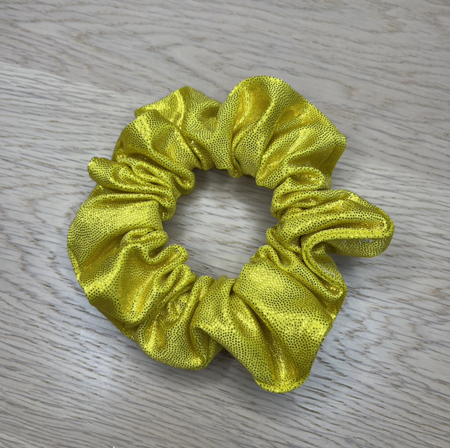 Keltainen glitter hiusdonitsi