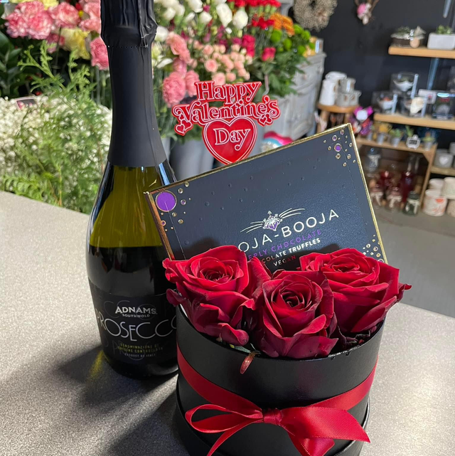 Three red roses chocolate and Prosecco hat box 