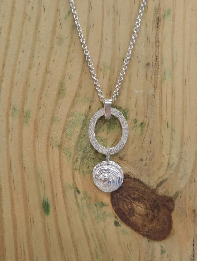 Sundial shell on textured loop necklace